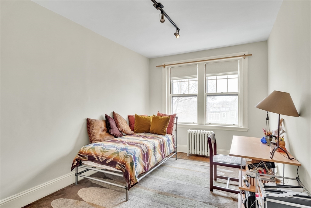 321 Tappan Street, Unit 3 Brookline, MA 02445 - Photo 29 of 39 a bedroom with a bed and a window