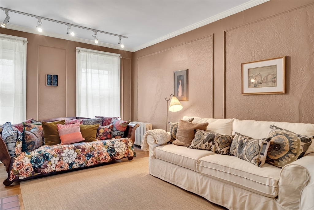 321 Tappan Street, Unit 3 Brookline, MA 02445 - Photo 5 of 39 a living room with furniture and a large window