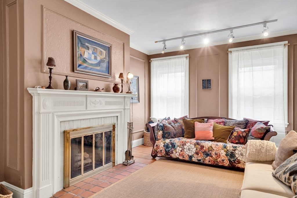 321 Tappan Street, Unit 3 Brookline, MA 02445 - Photo 6 of 39 a living room with furniture and a fireplace