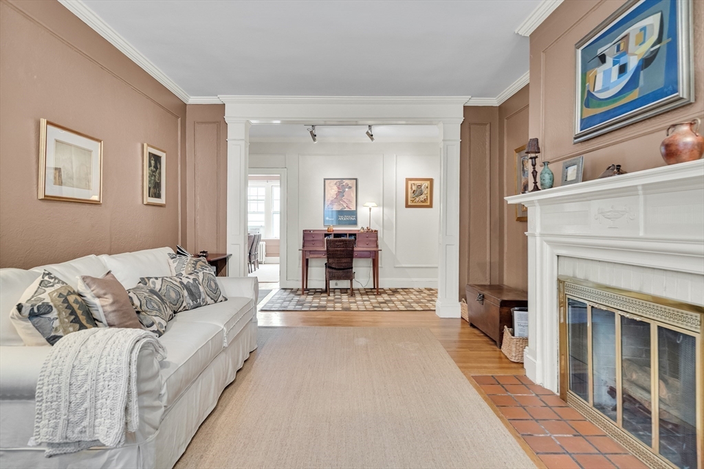 321 Tappan Street, Unit 3 Brookline, MA 02445 - Photo 7 of 39 a living room with furniture and a fireplace