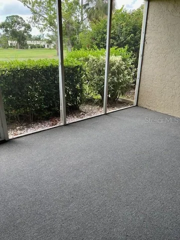 a view of a park with large trees