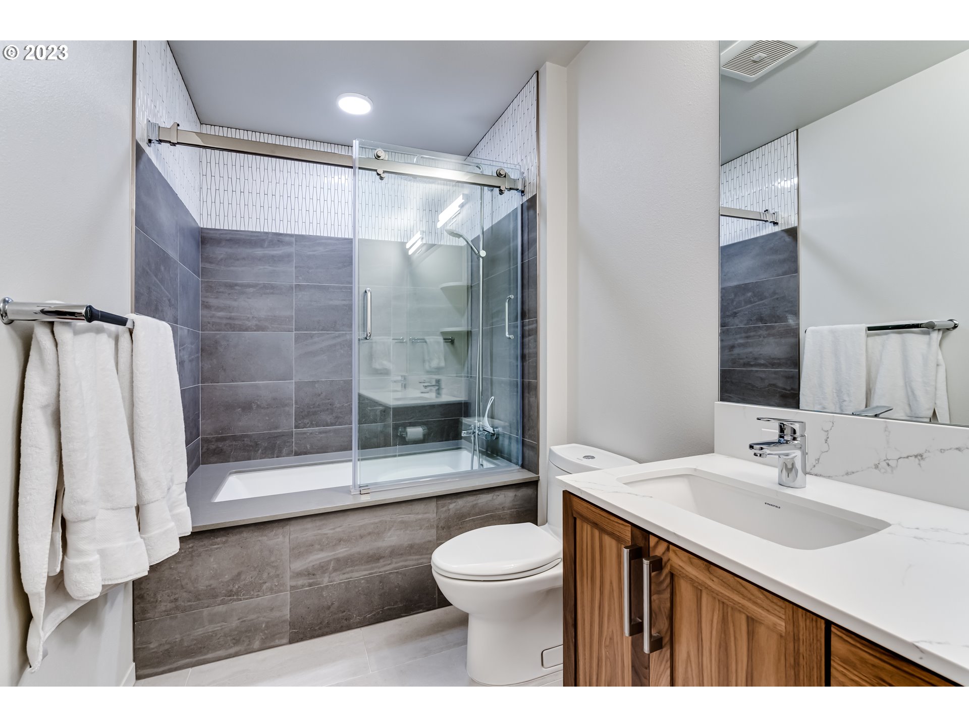 1600 Pearl Street Eugene, OR 97401 - Photo 11 of 21 a bathroom with a sink toilet a mirror and shower