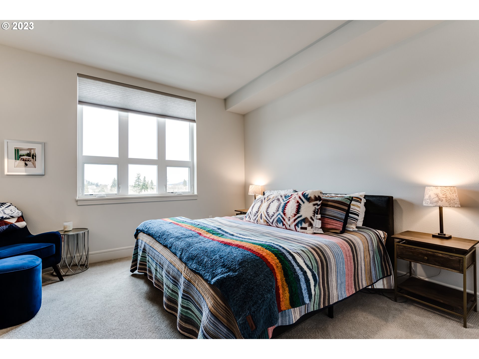 1600 Pearl Street Eugene, OR 97401 - Photo 14 of 21 a bedroom with a bed a lamp and a window
