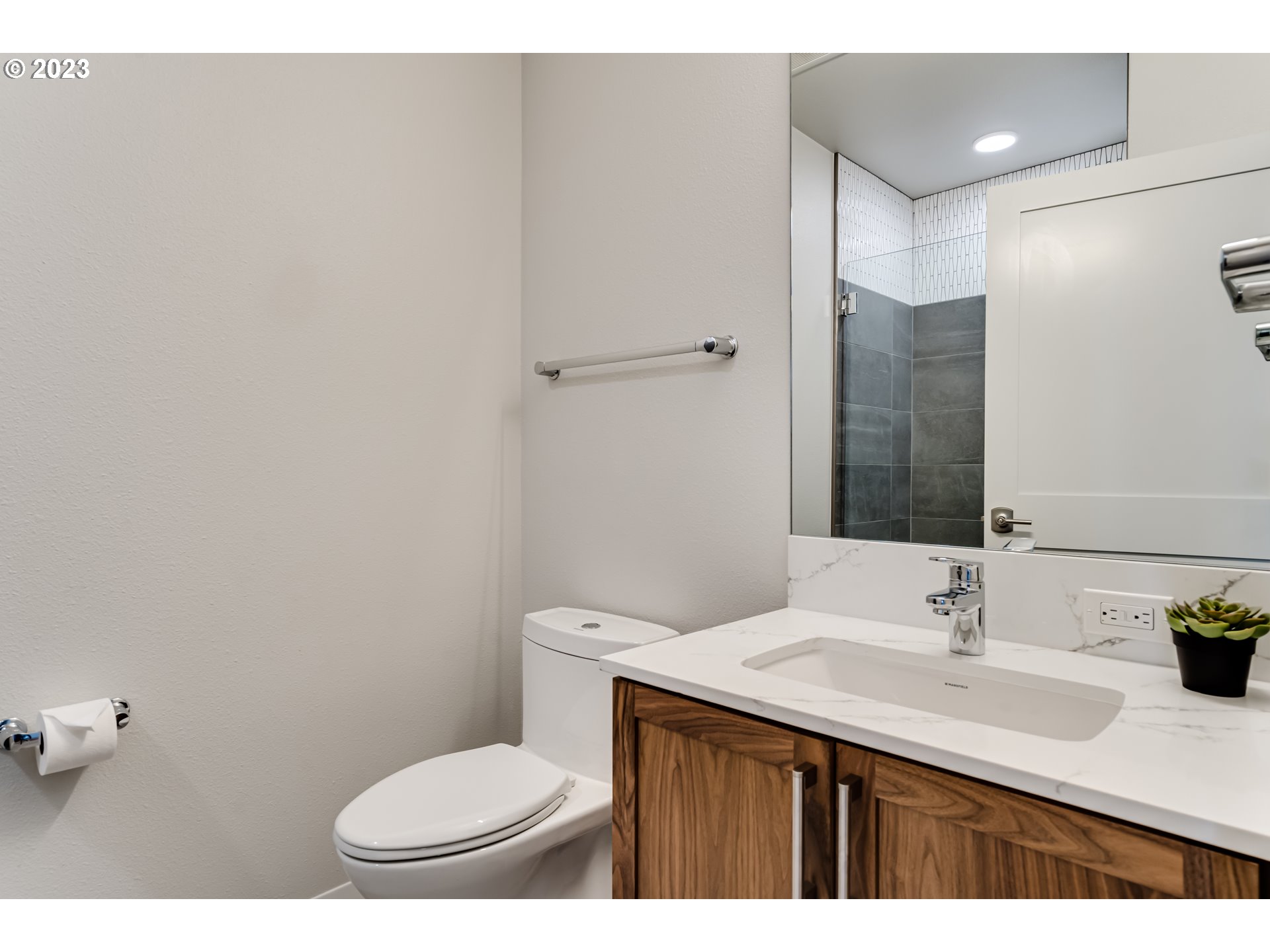 1600 Pearl Street Eugene, OR 97401 - Photo 7 of 21 a bathroom with a granite countertop sink toilet and a mirror