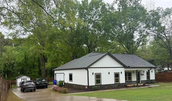 a house view with a garden space