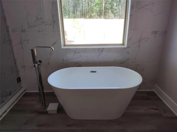 a white bath tub sitting in a bathroom