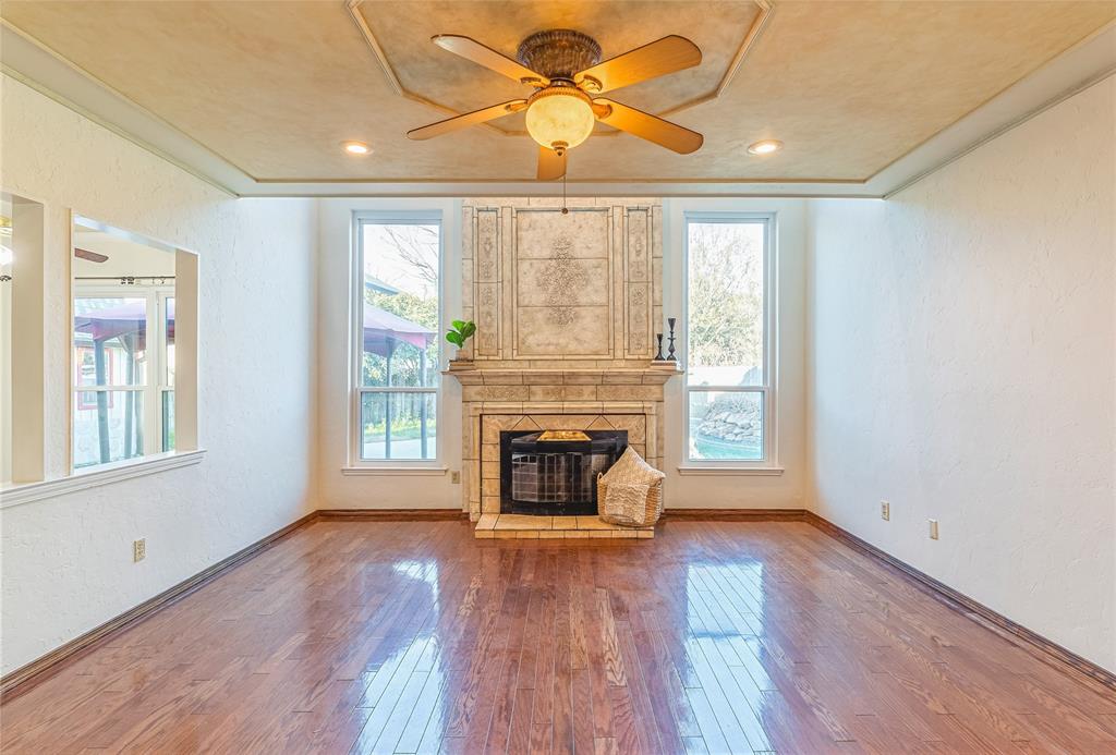 a view of a livingroom with furniture window and wooden floor