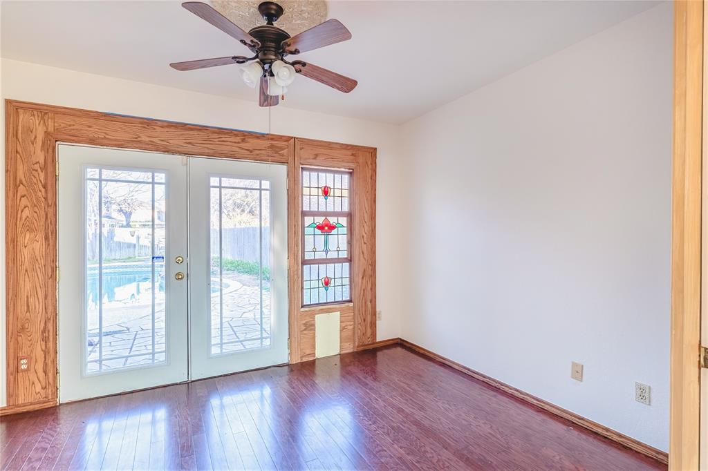 716 Bridget Way Hurst, TX 76054 - Photo 16 of 33 Entryway with french doors, a ceiling fan, and hardwood / wood-style floors