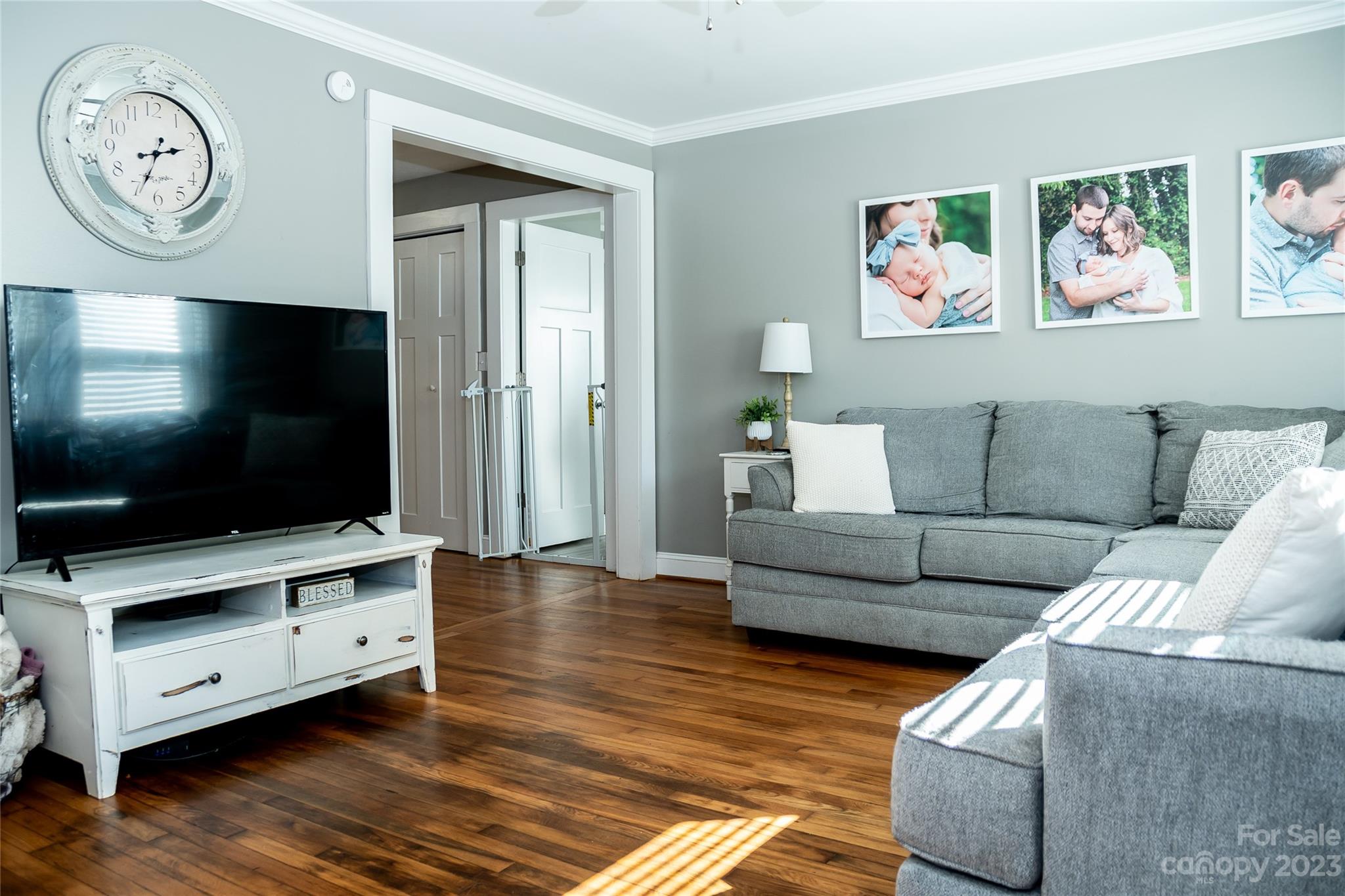 106 Cascade Street Morganton, NC 28655 - Photo 11 of 36 a living room with furniture and a flat screen tv