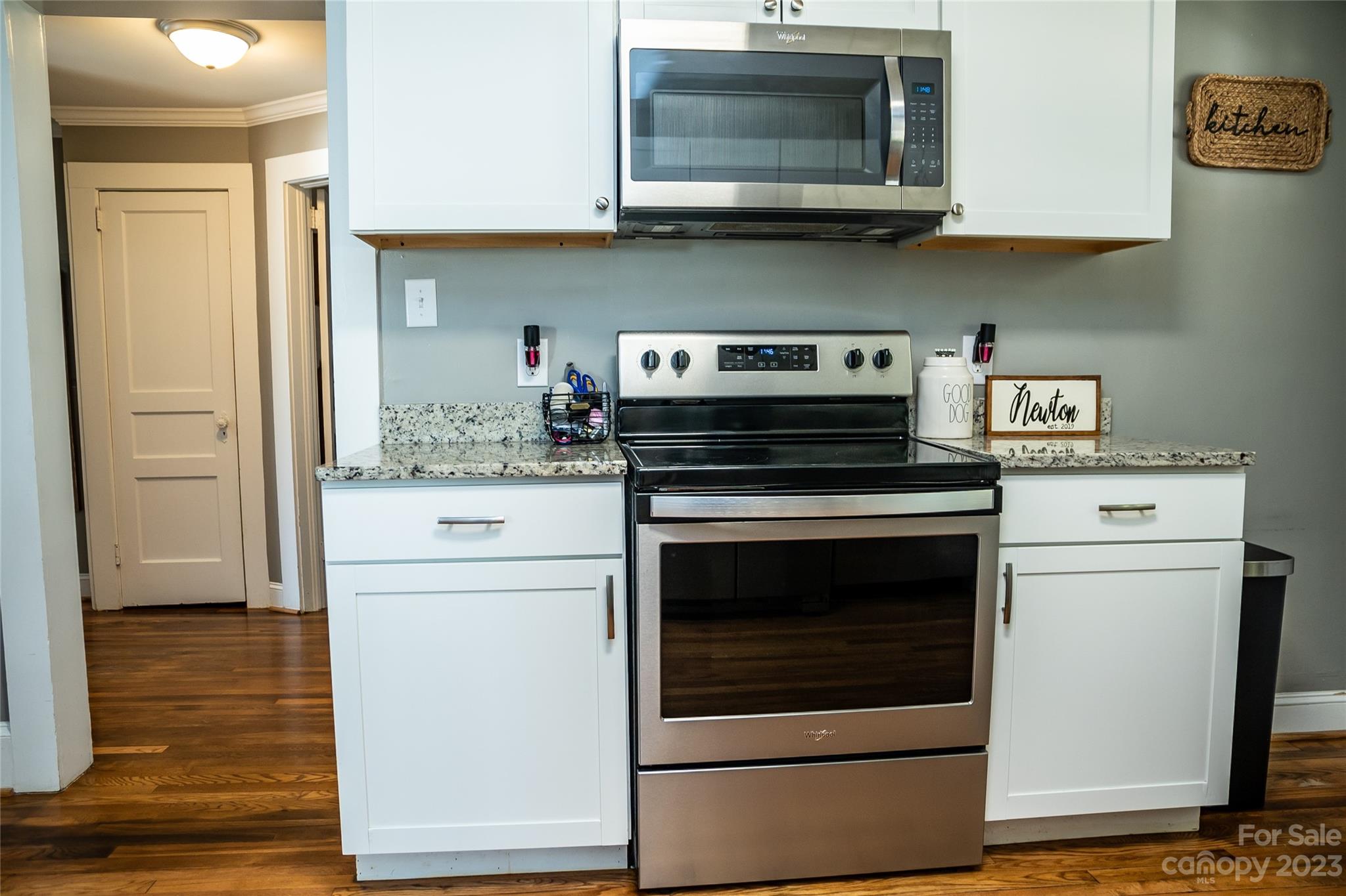 106 Cascade Street Morganton, NC 28655 - Photo 13 of 36 a kitchen with a stove and a microwave