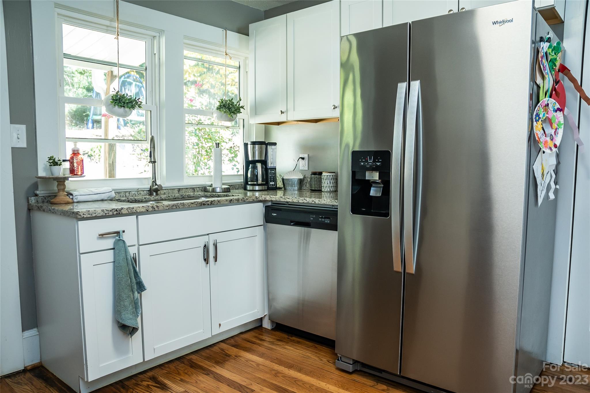 106 Cascade Street Morganton, NC 28655 - Photo 14 of 36 a kitchen with stainless steel appliances granite countertop a refrigerator and a sink