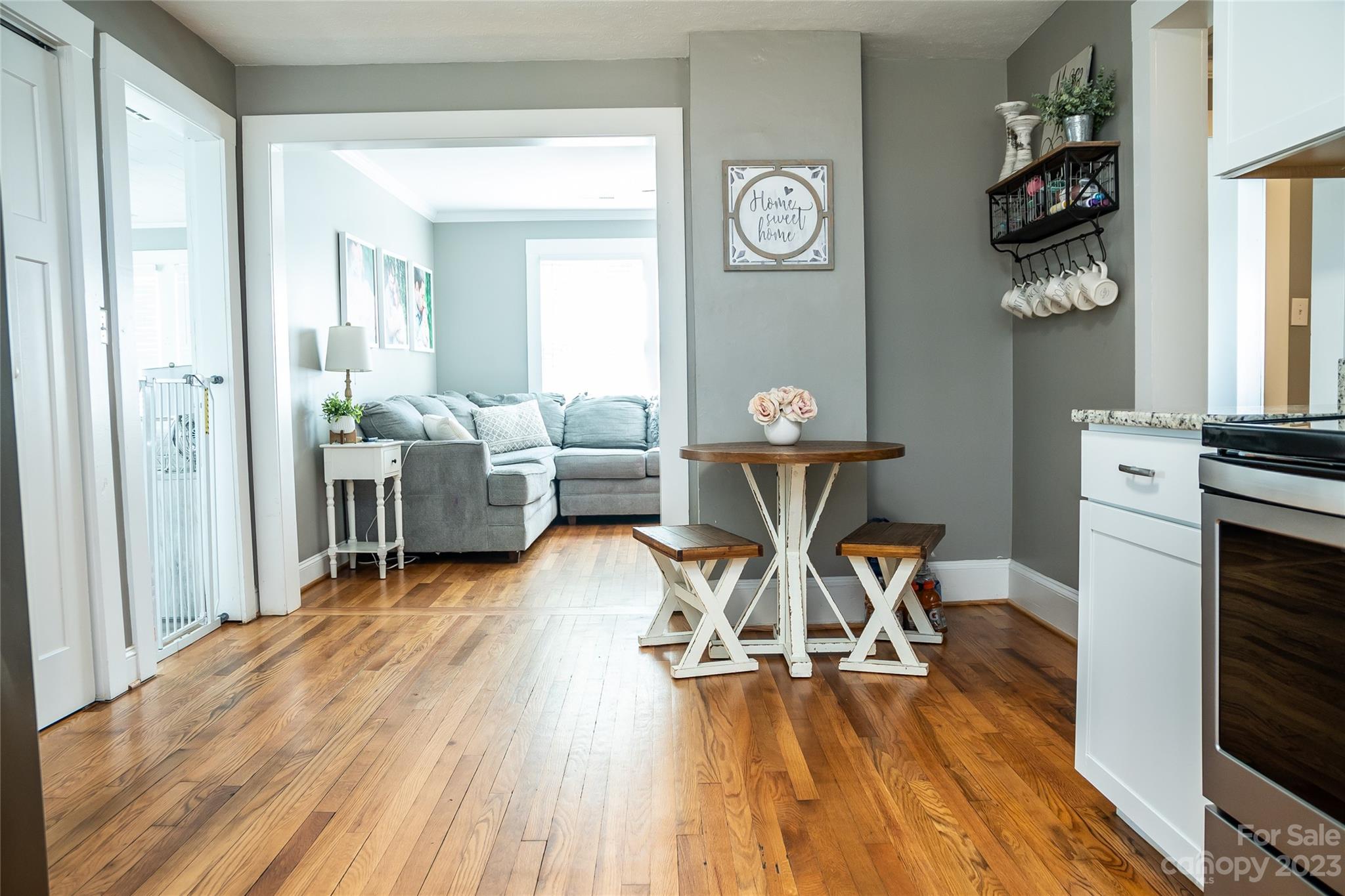 106 Cascade Street Morganton, NC 28655 - Photo 20 of 36 a living room with furniture and a wooden floor