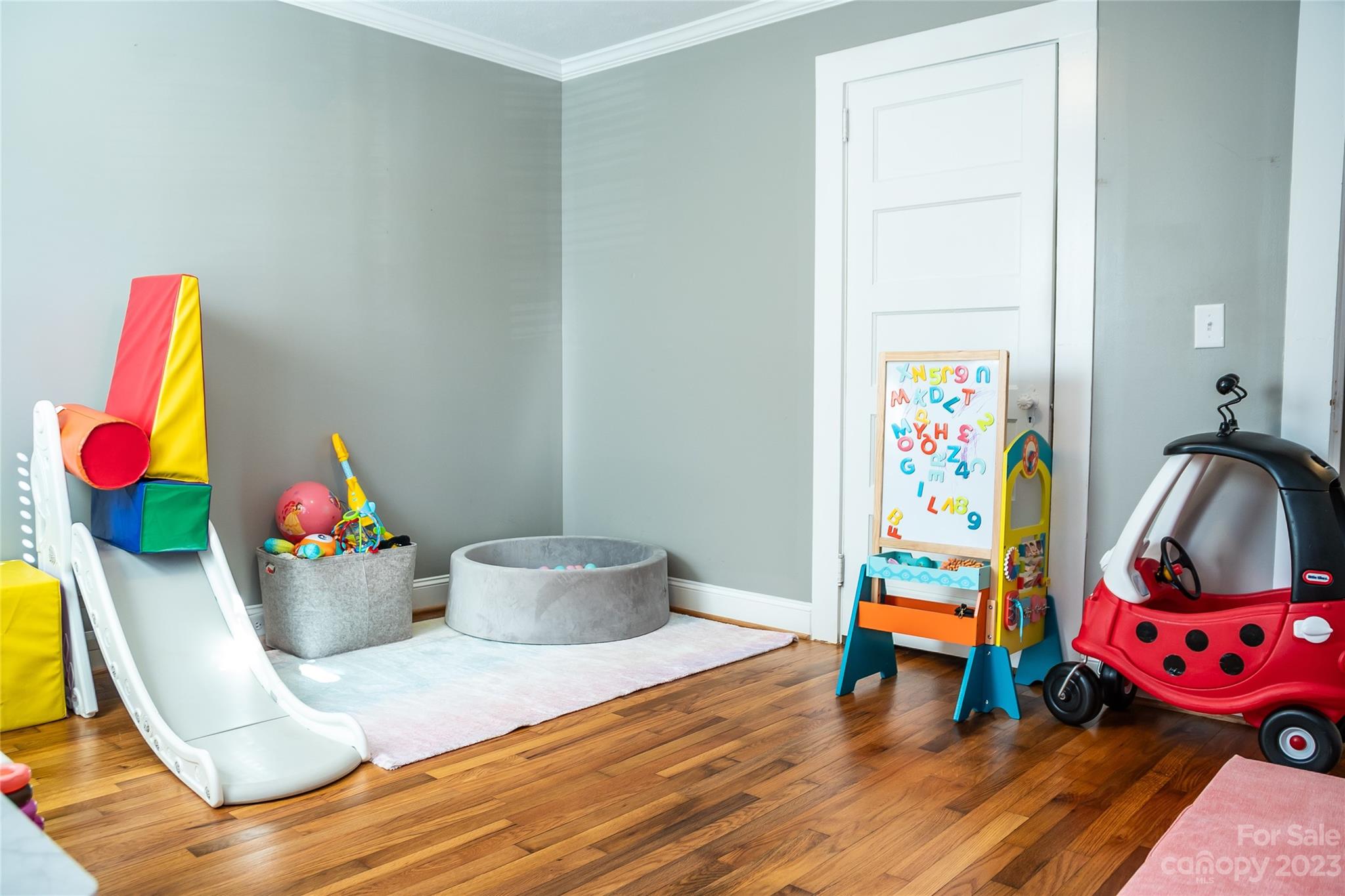 106 Cascade Street Morganton, NC 28655 - Photo 24 of 36 a living room with furniture and a wooden floor