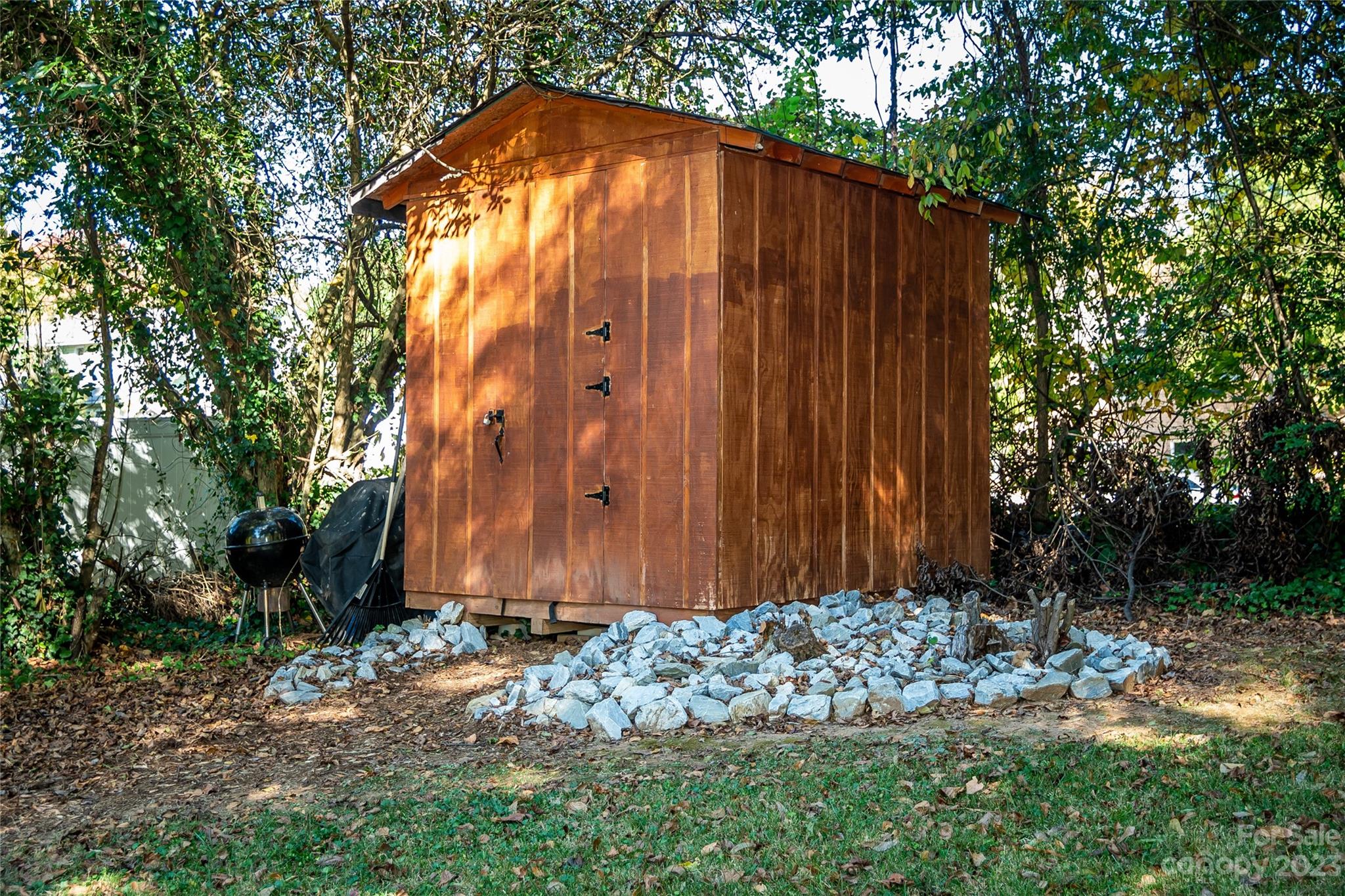 106 Cascade Street Morganton, NC 28655 - Photo 32 of 36 a wooden fence with some trees in the back