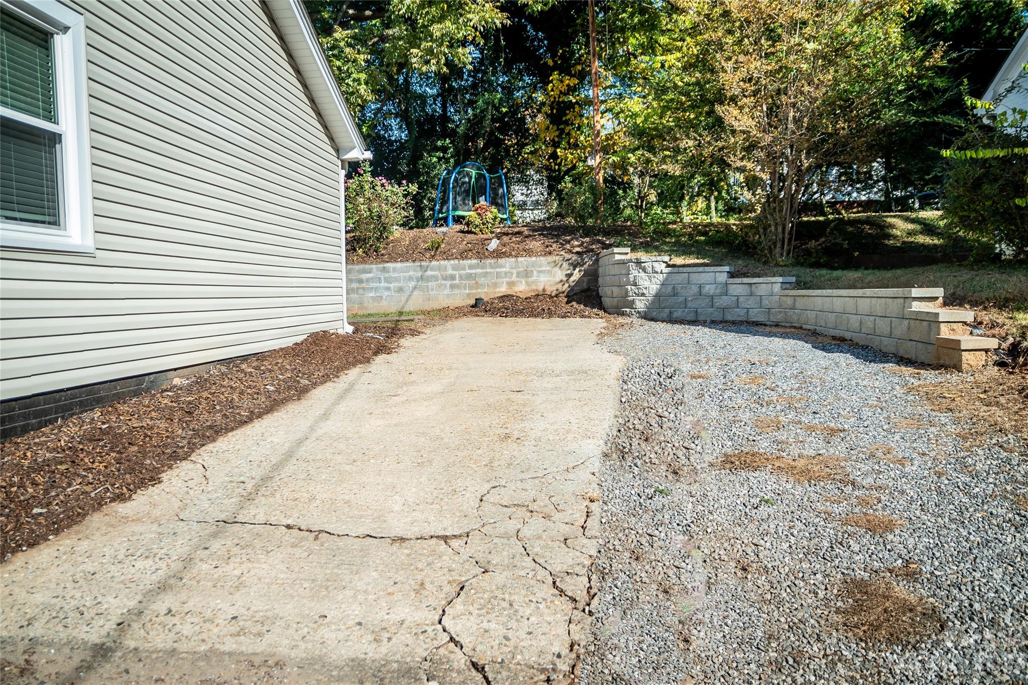 106 Cascade Street Morganton, NC 28655 - Photo 8 of 36 a view of a yard with plants and trees