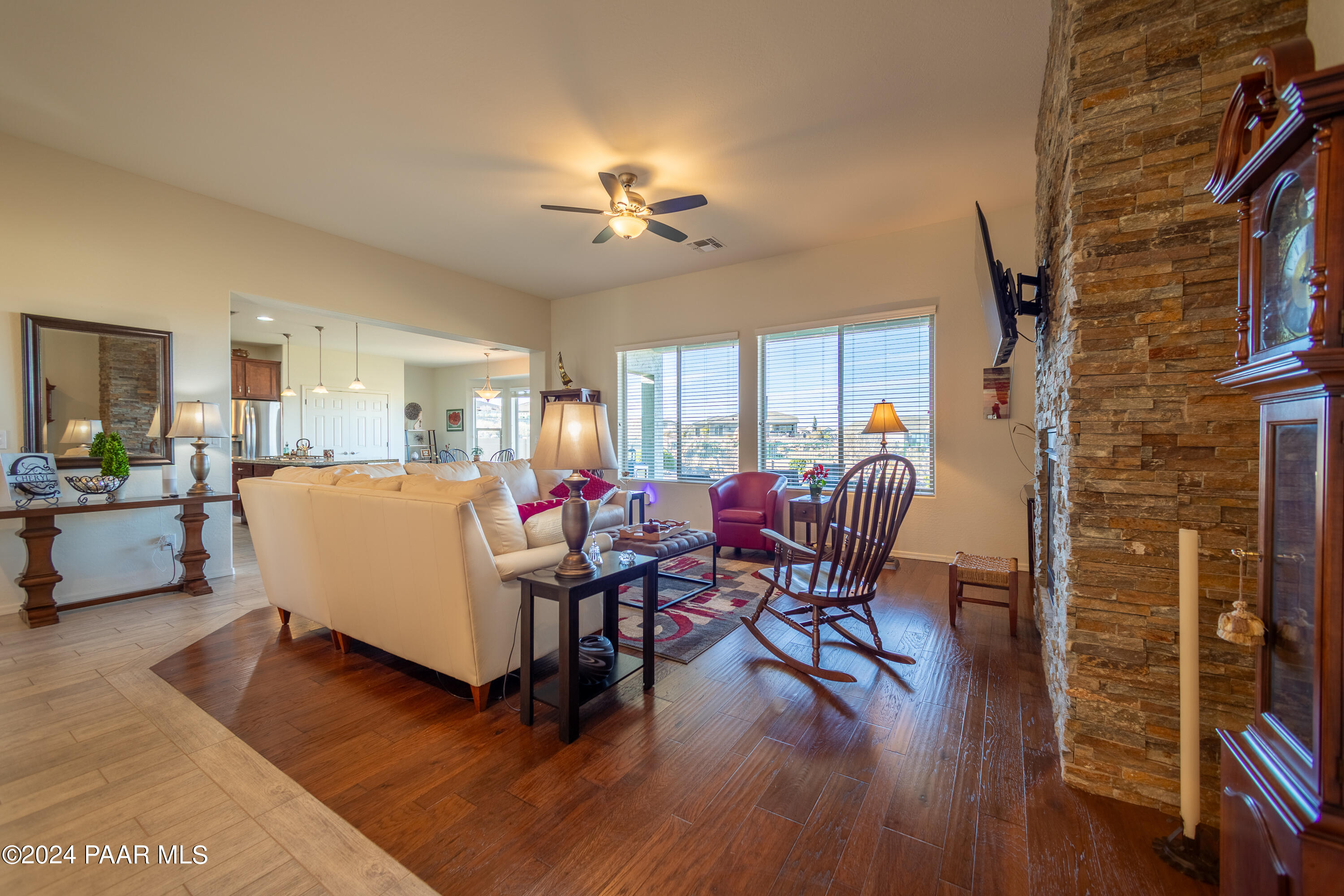 1109 Stack Rock Road Prescott Valley, AZ 86314 - Photo 11 of 91 a living room with furniture dining table and wooden floor
