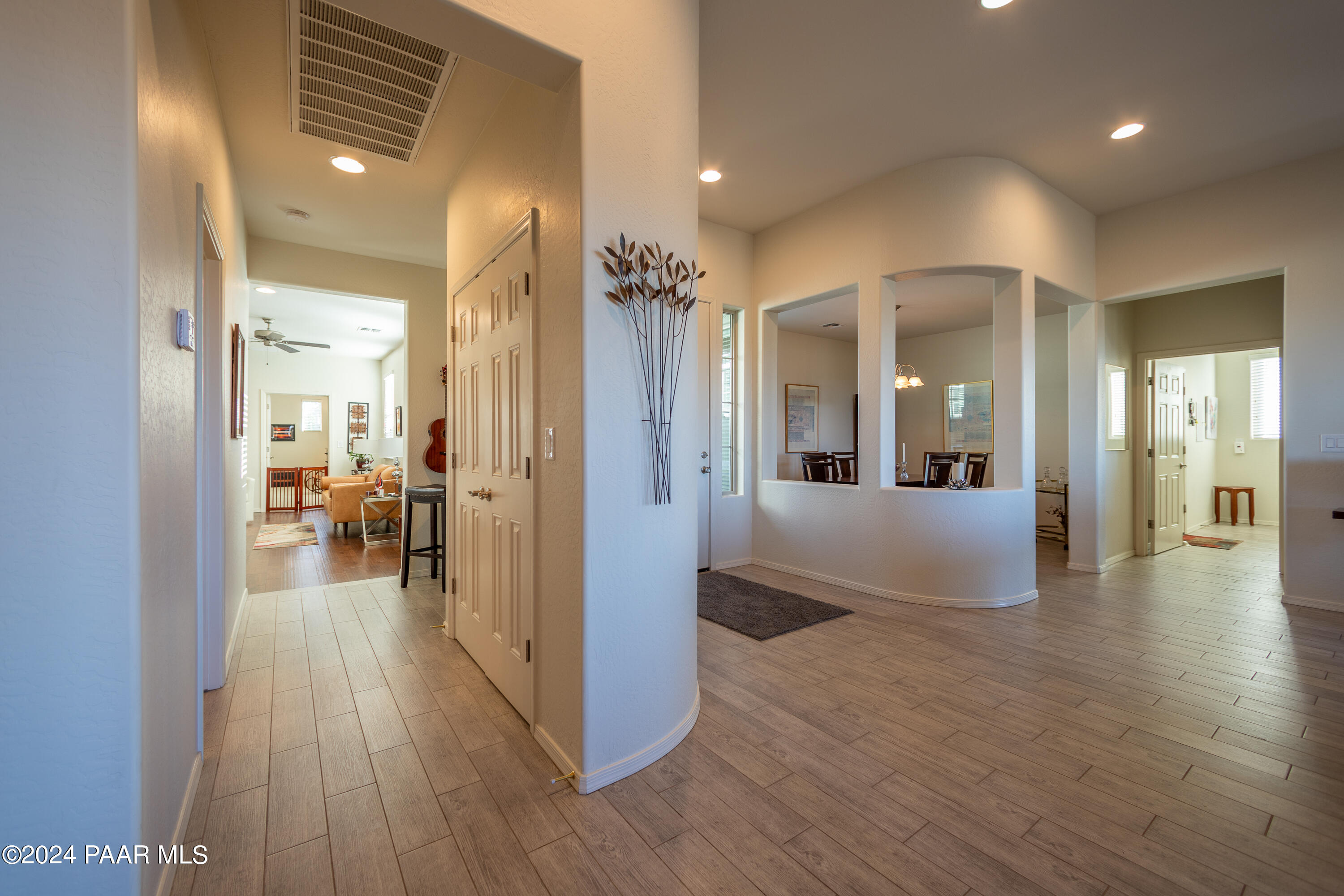 1109 Stack Rock Road Prescott Valley, AZ 86314 - Photo 22 of 91 a view of a hallway view with wooden floor and living room