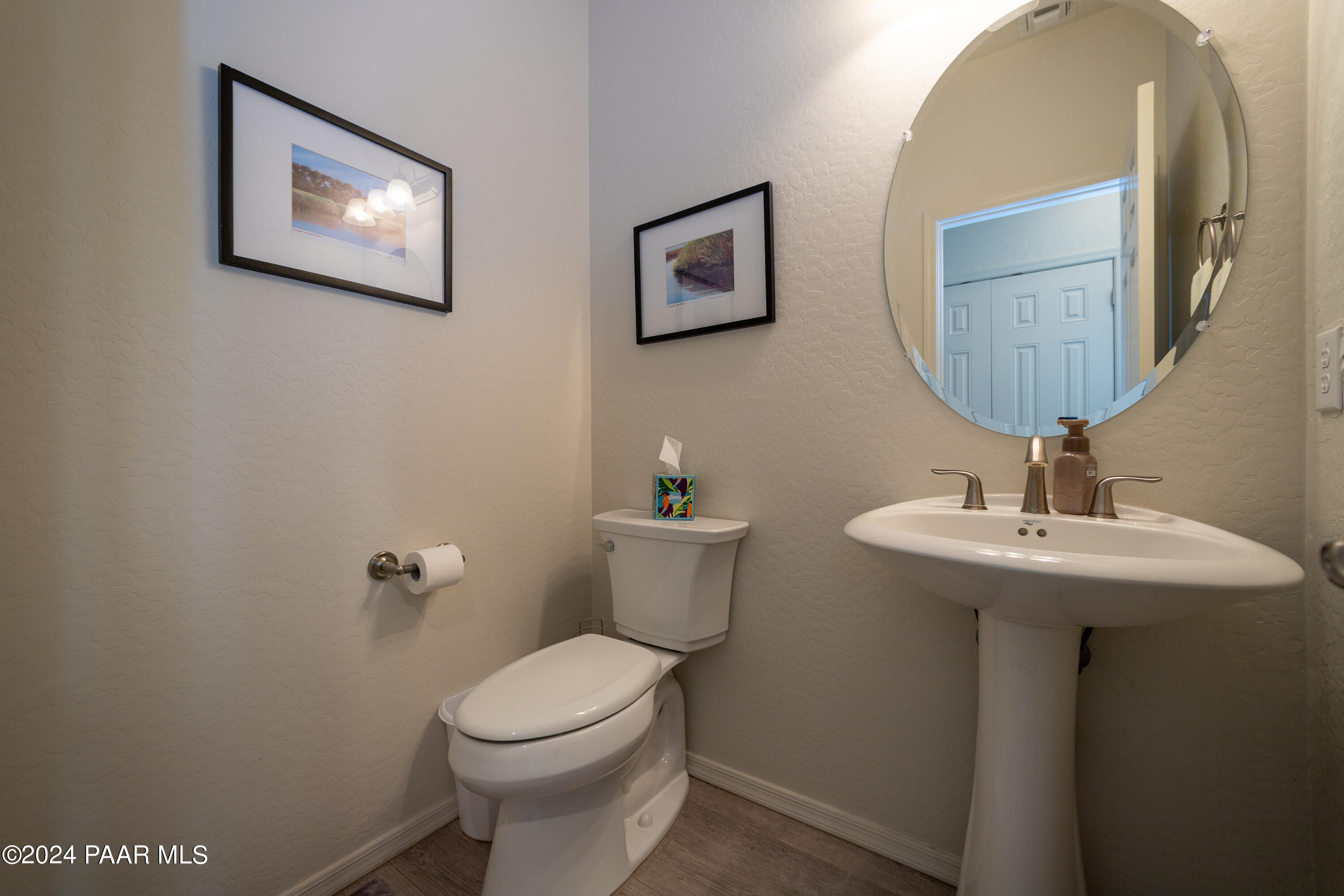 1109 Stack Rock Road Prescott Valley, AZ 86314 - Photo 26 of 91 a bathroom with a toilet a sink and mirror