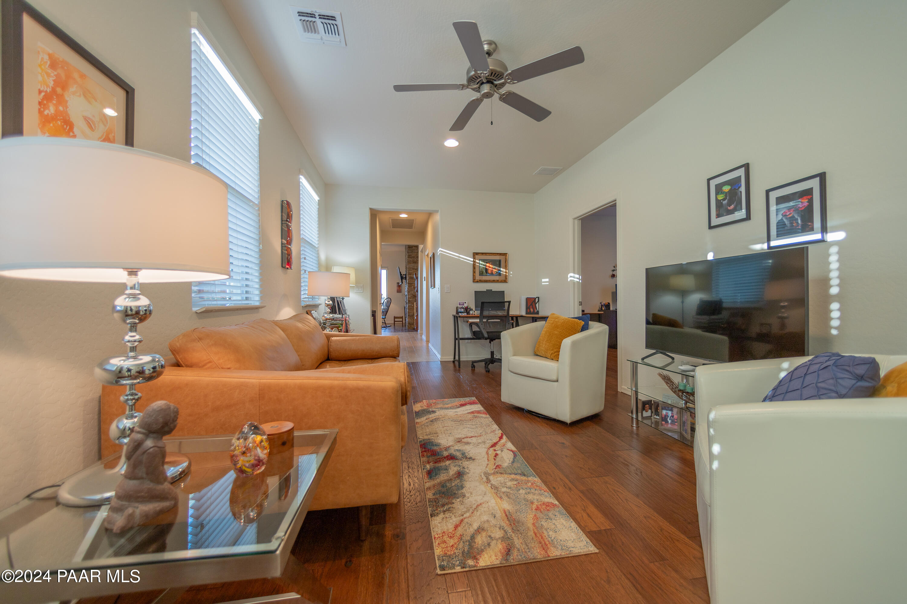 1109 Stack Rock Road Prescott Valley, AZ 86314 - Photo 28 of 91 a living room with furniture and a flat screen tv