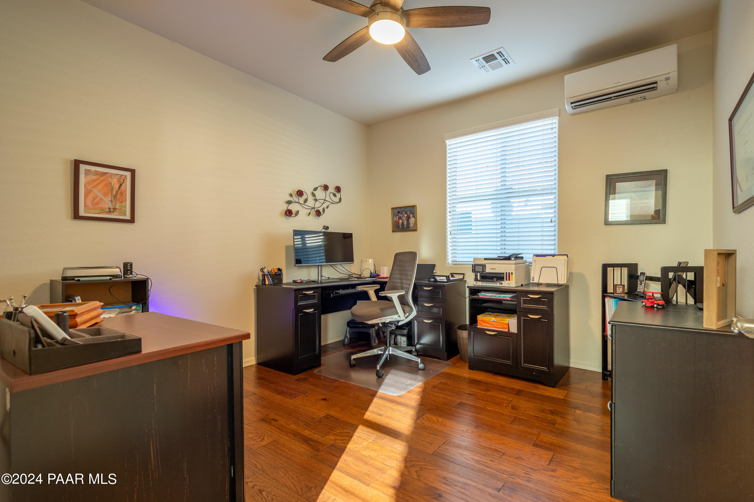 1109 Stack Rock Road Prescott Valley, AZ 86314 - Photo 29 of 91 a view of a workspace with furniture and a window
