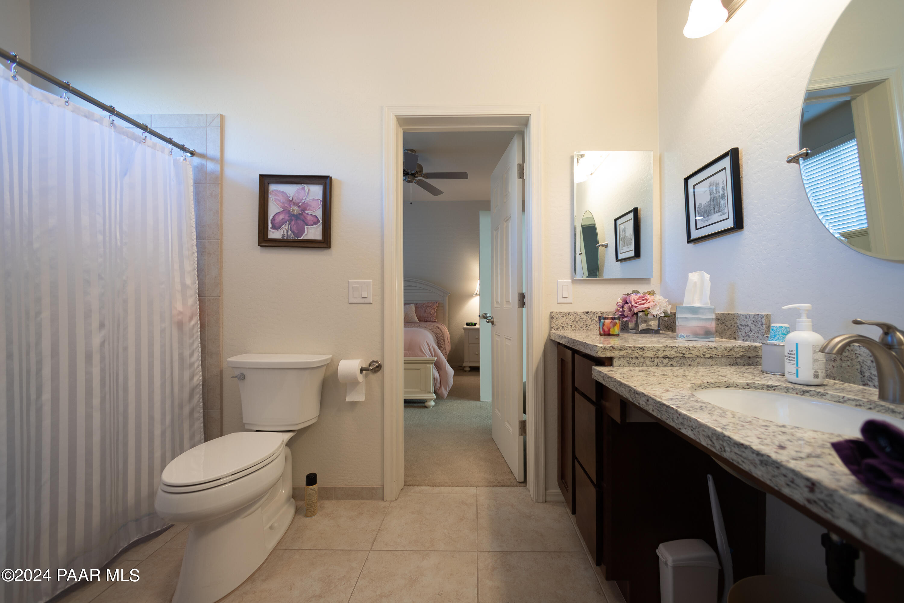 1109 Stack Rock Road Prescott Valley, AZ 86314 - Photo 32 of 91 a bathroom with a granite countertop toilet sink and mirror