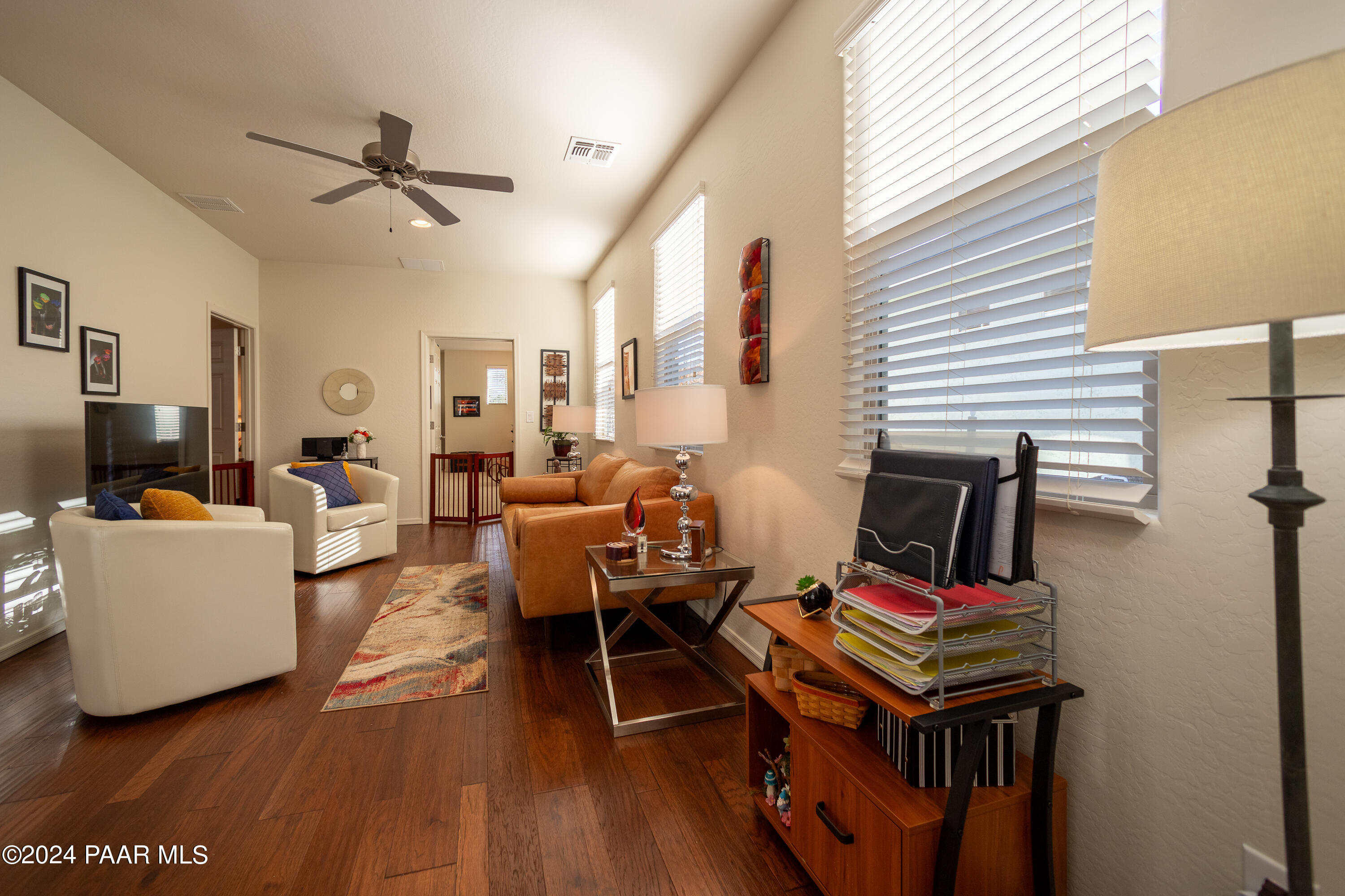 1109 Stack Rock Road Prescott Valley, AZ 86314 - Photo 34 of 91 a living room with furniture and a flat screen tv
