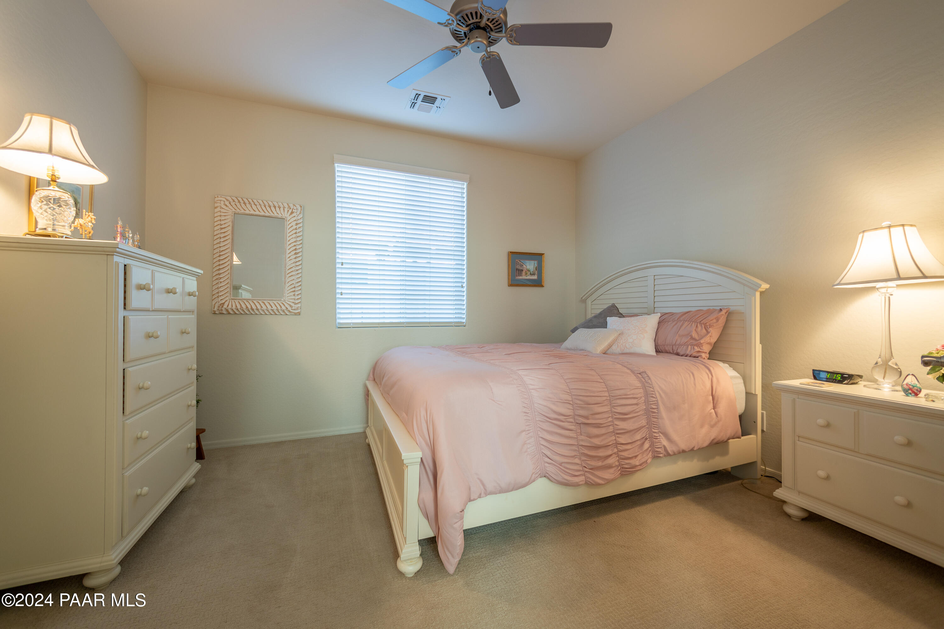 1109 Stack Rock Road Prescott Valley, AZ 86314 - Photo 35 of 91 a bedroom with a bed and a cabinets