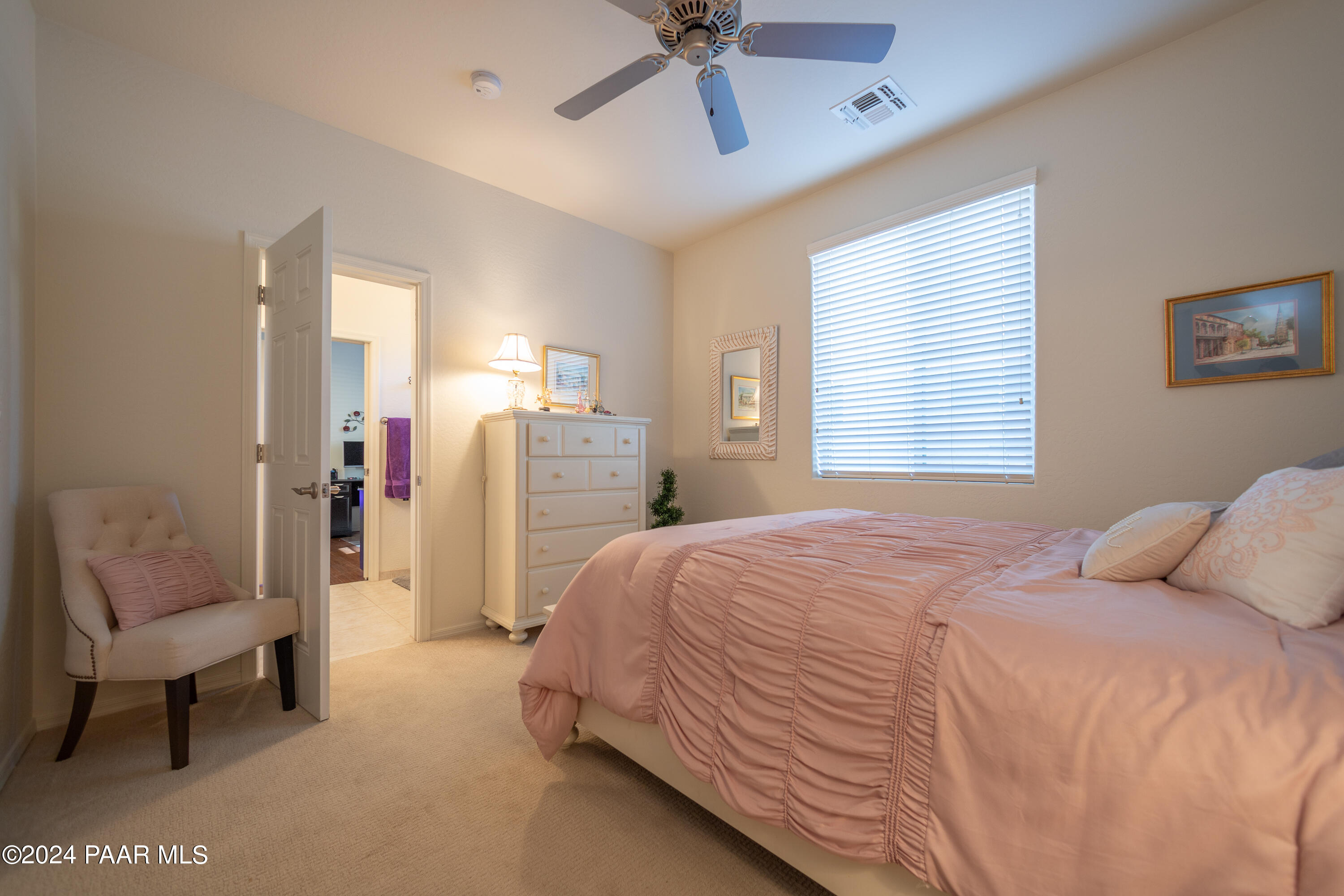 1109 Stack Rock Road Prescott Valley, AZ 86314 - Photo 37 of 91 a bedroom with a bed and a couch