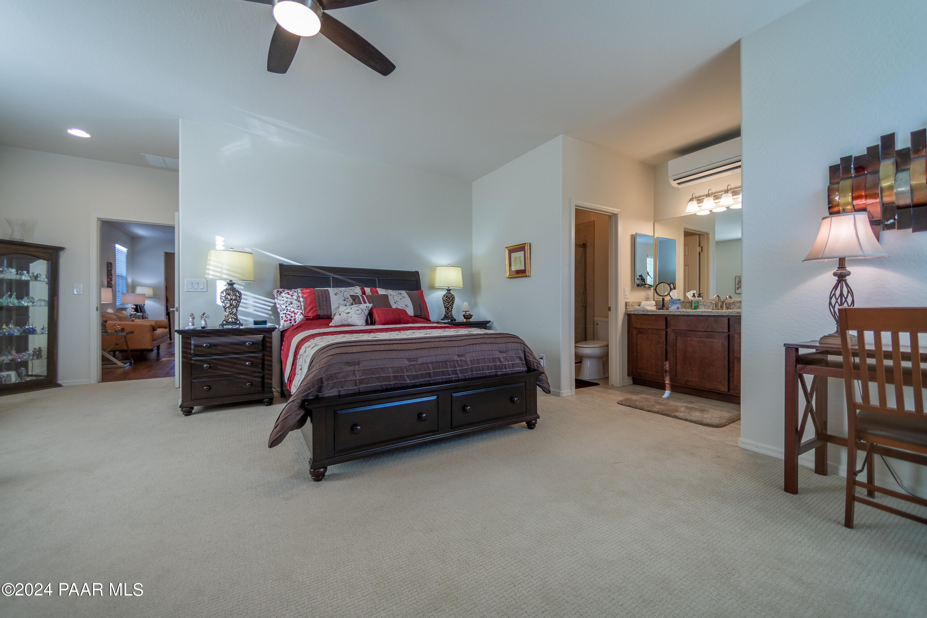 1109 Stack Rock Road Prescott Valley, AZ 86314 - Photo 40 of 91 a bedroom with a bed and a chandelier