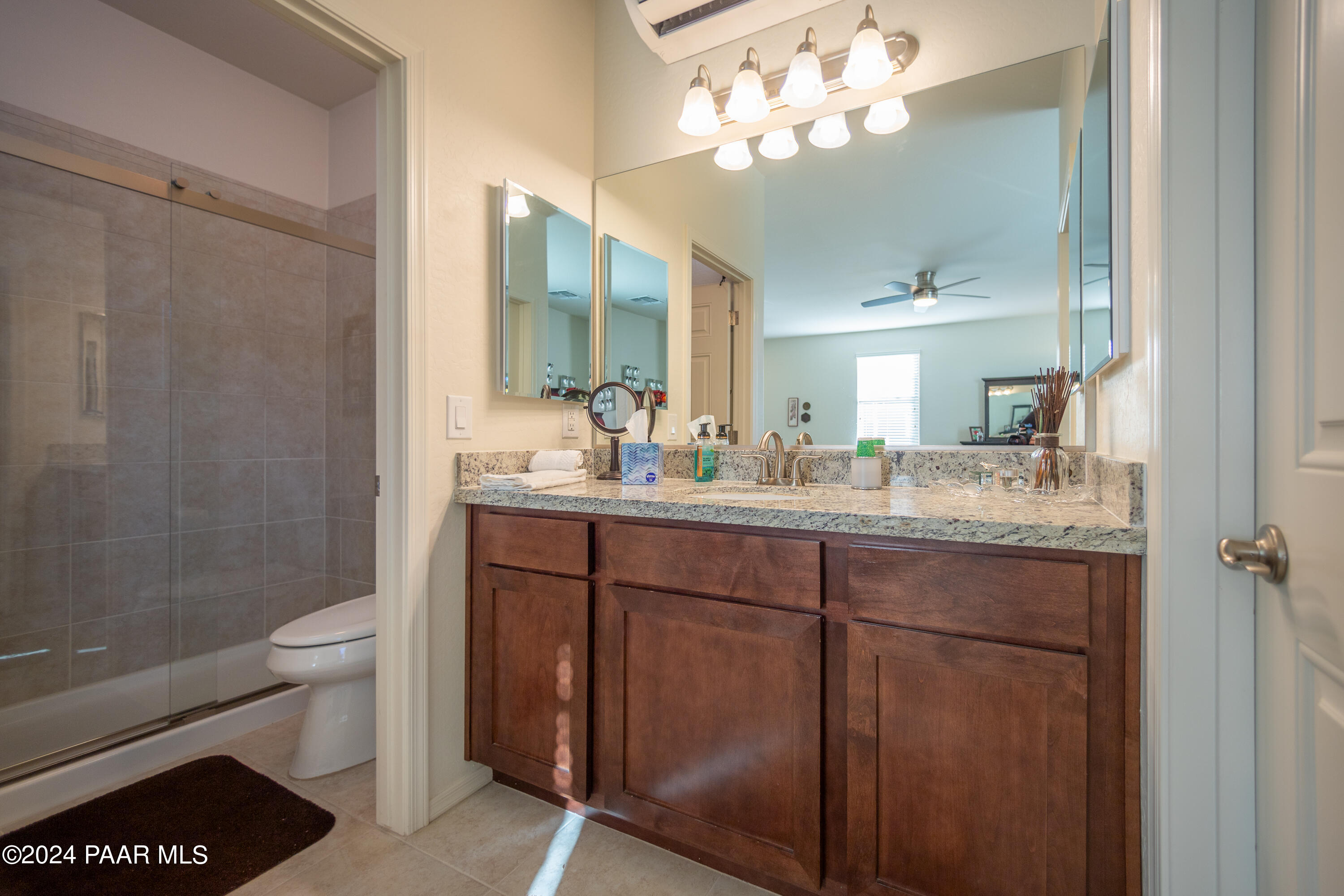 1109 Stack Rock Road Prescott Valley, AZ 86314 - Photo 44 of 91 a bathroom with a sink a toilet and a mirror