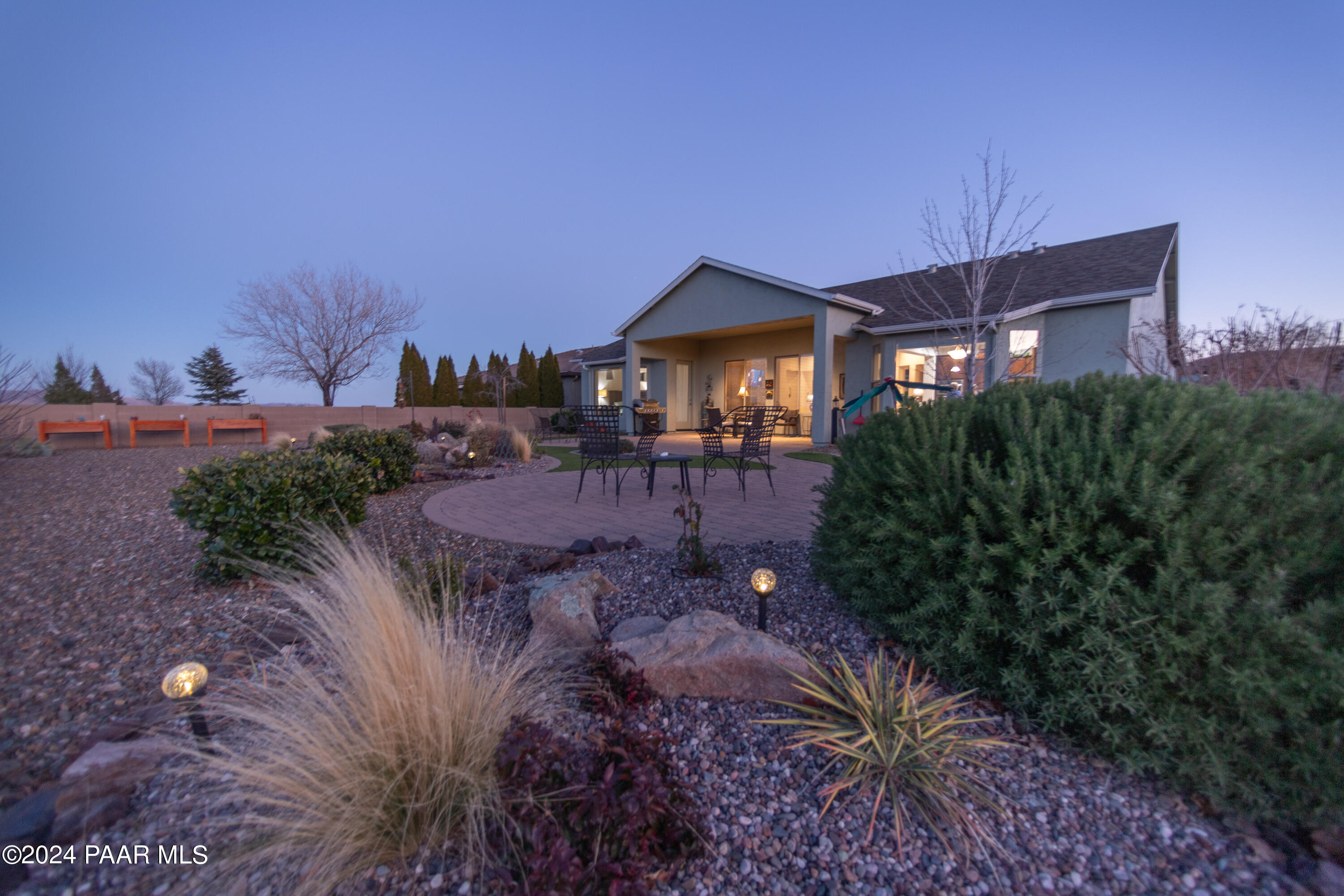 1109 Stack Rock Road Prescott Valley, AZ 86314 - Photo 65 of 91 a view of a house with a yard and potted plants