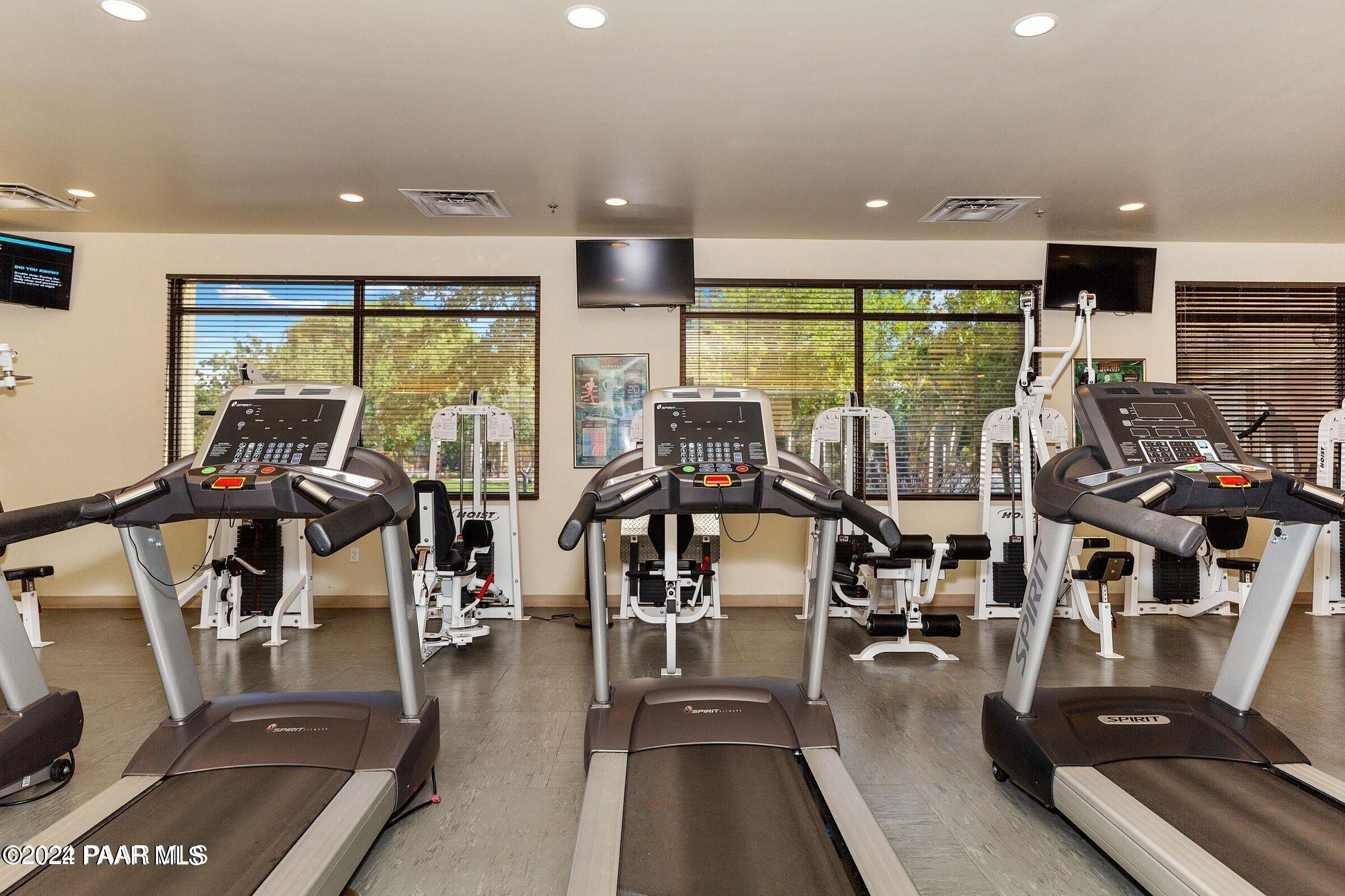 1109 Stack Rock Road Prescott Valley, AZ 86314 - Photo 88 of 91 a view of a living room with wooden floor and floor to ceiling window