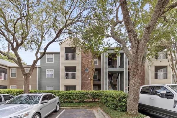 a front view of a house with parking space
