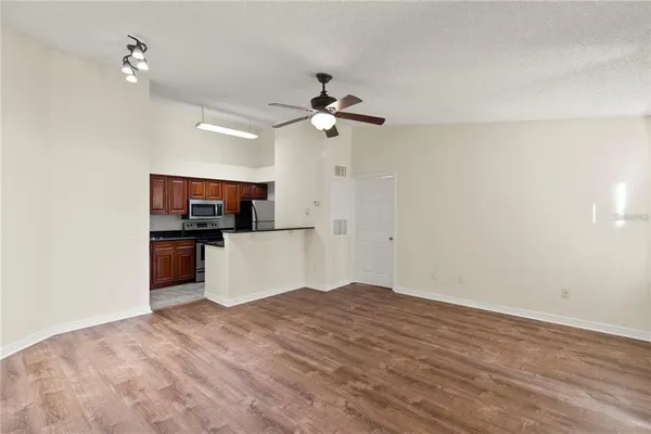 a view of a kitchen with microwave and cabinets