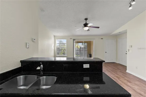 a kitchen with a sink and a window