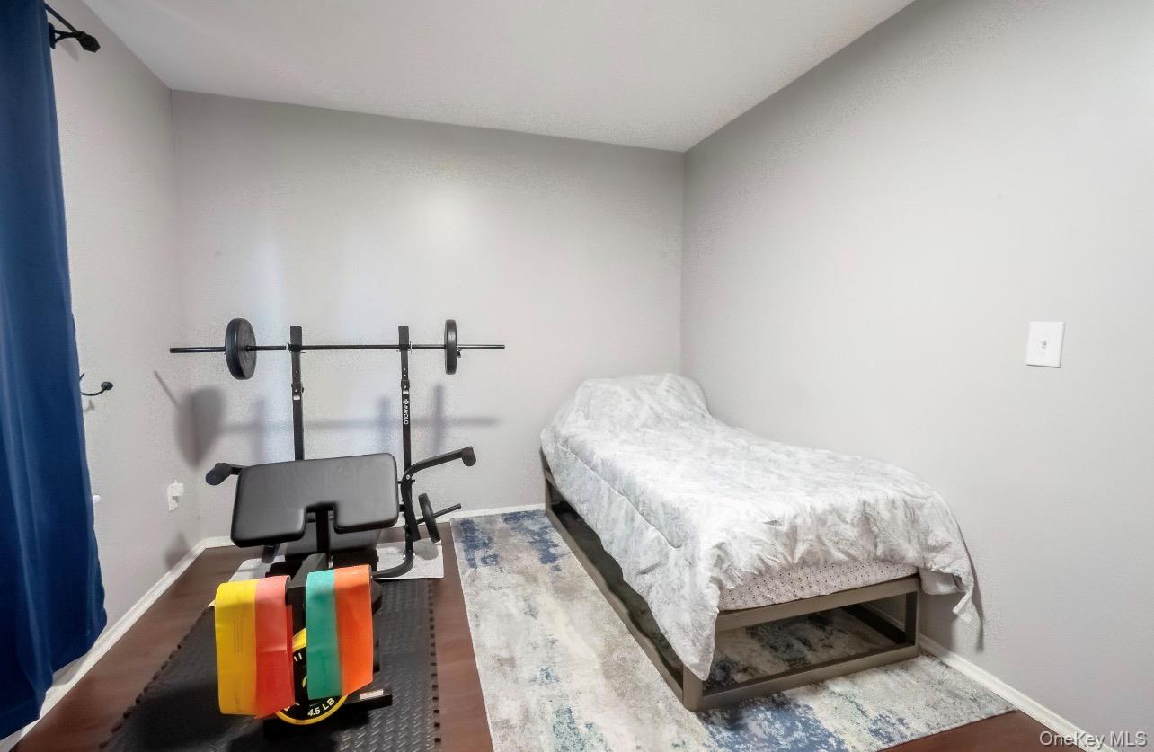 276 Temple Hill Road, Unit 704 New Windsor, NY 12553 - Photo 14 of 18 a bedroom with a bed and dresser