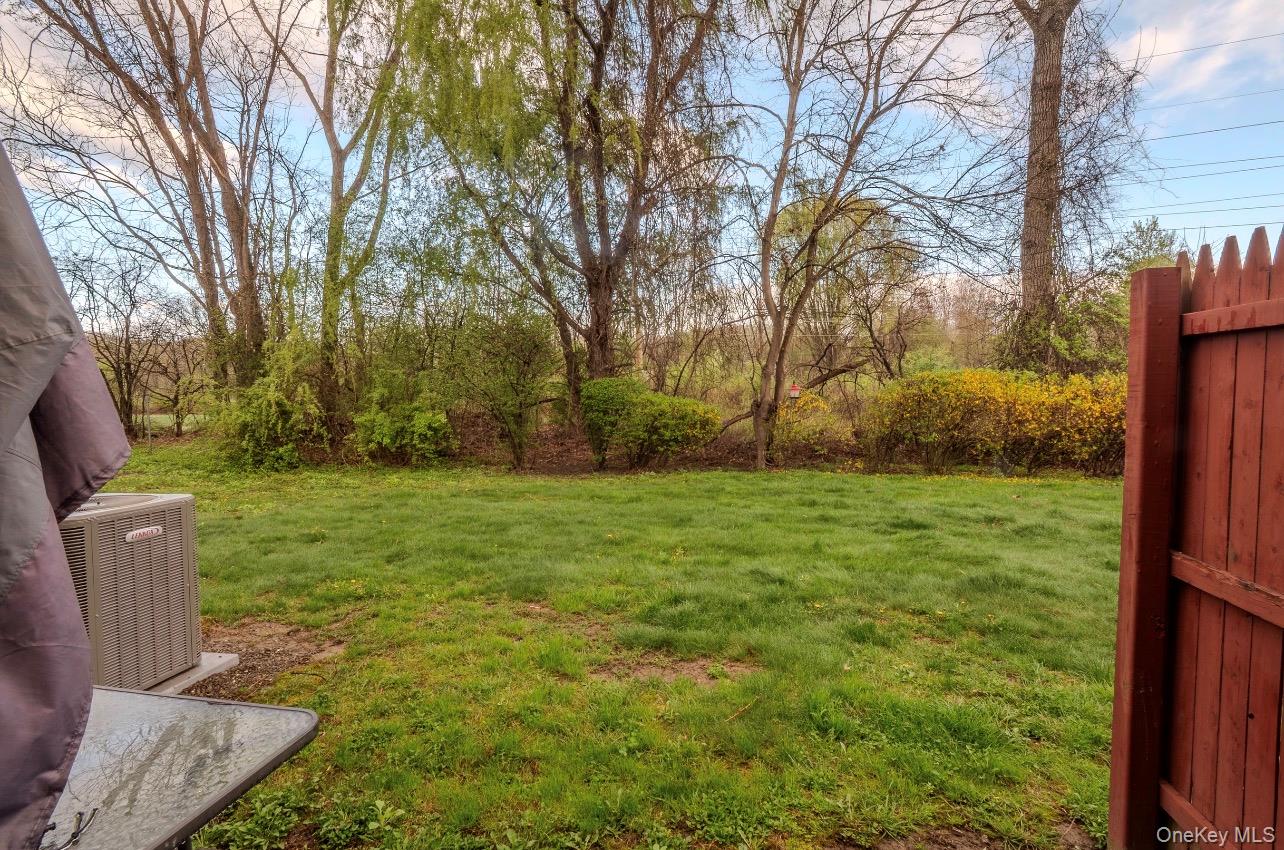 276 Temple Hill Road, Unit 704 New Windsor, NY 12553 - Photo 17 of 18 a view of a backyard with large trees
