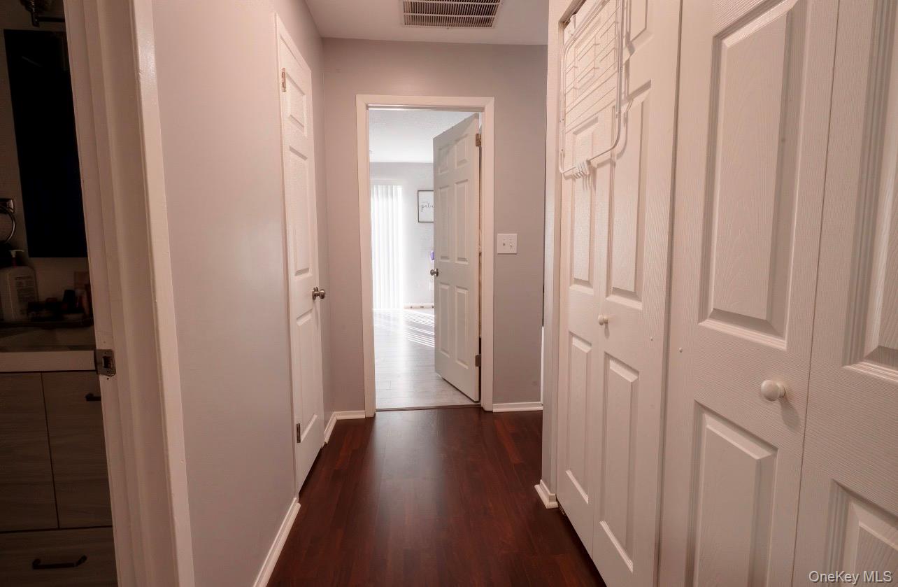 276 Temple Hill Road, Unit 704 New Windsor, NY 12553 - Photo 8 of 18 a view of a hallway with wooden floor