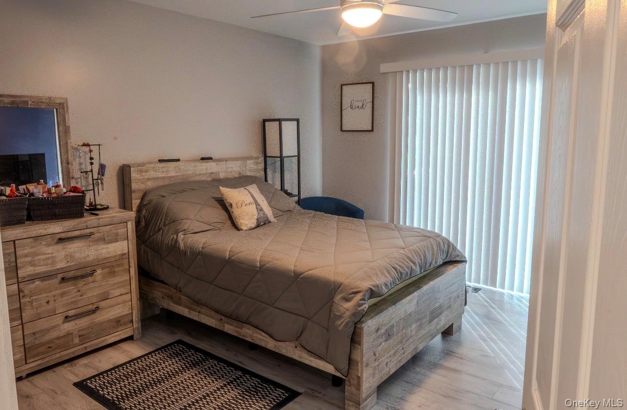 276 Temple Hill Road, Unit 704 New Windsor, NY 12553 - Photo 9 of 18 a bedroom with a bed and a window