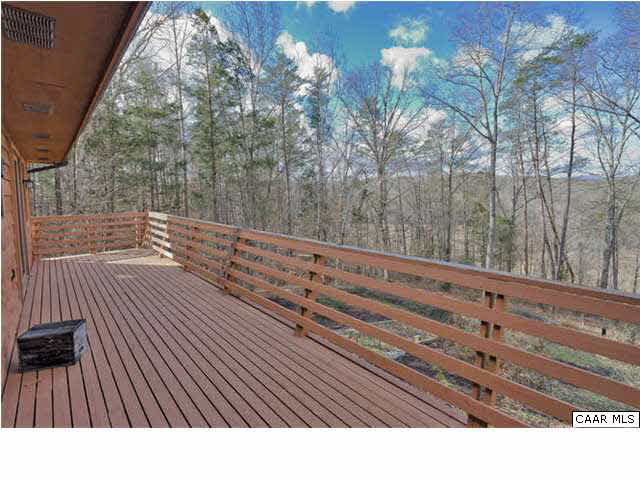 452 Buffalo Run Road Stanardsville, VA 22973 - Photo 16 of 26 a view of balcony with wooden floor and trees