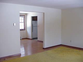 Undisclosed Address Centerville, MA 02632 - Photo 3 of 4 an empty room with closet and windows