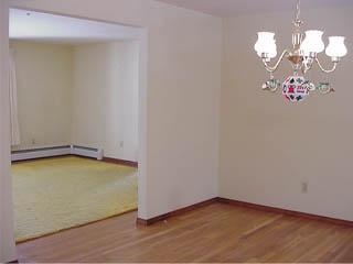 Undisclosed Address Centerville, MA 02632 - Photo 4 of 4 an empty room with a mirror