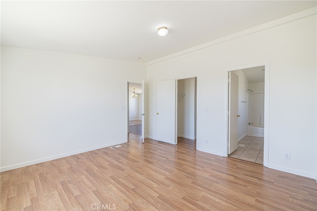 26321 Olanche Street Mojave, CA 93501 - Photo 18 of 39 a view of an empty room with wooden floor