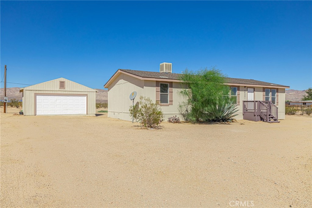 26321 Olanche Street Mojave, CA 93501 - Photo 2 of 39 a view of a house with a outdoor space