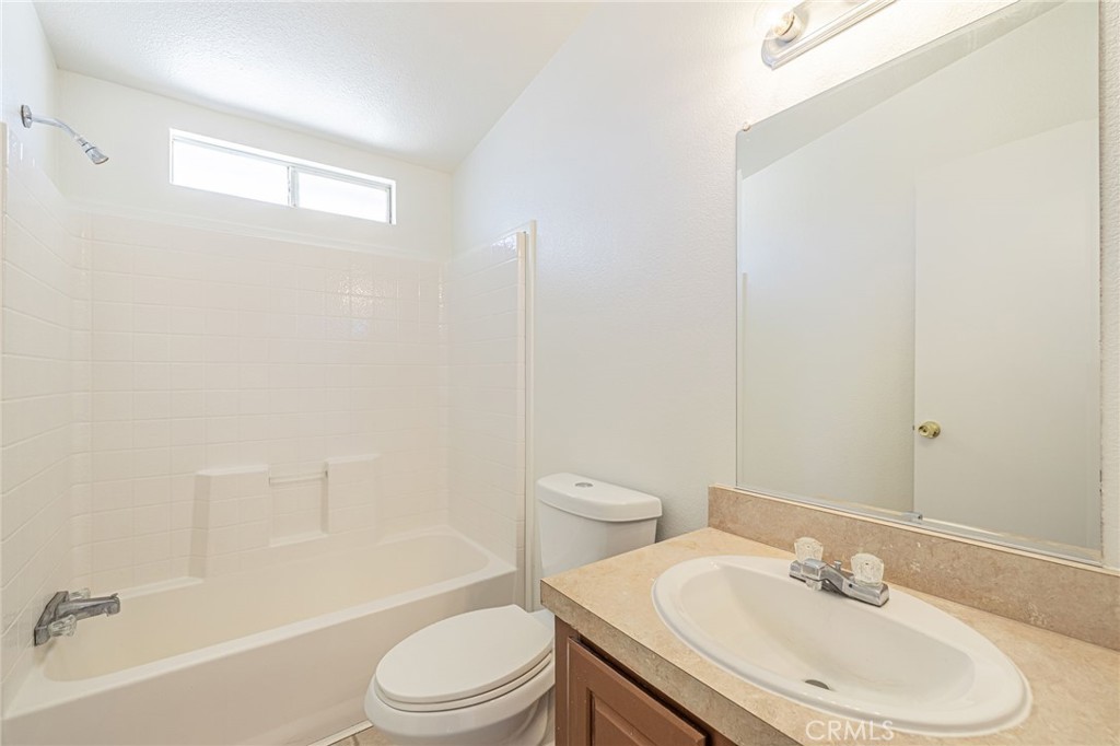 26321 Olanche Street Mojave, CA 93501 - Photo 21 of 39 a bathroom with a sink toilet and shower