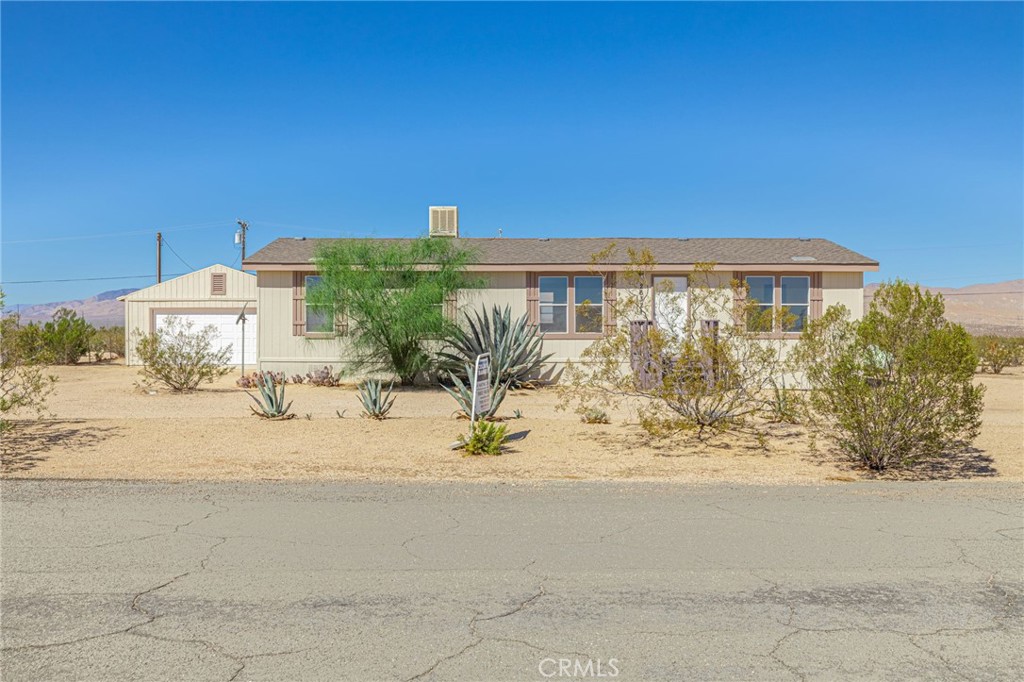 26321 Olanche Street Mojave, CA 93501 - Photo 3 of 39 a view of a house with a outdoor space