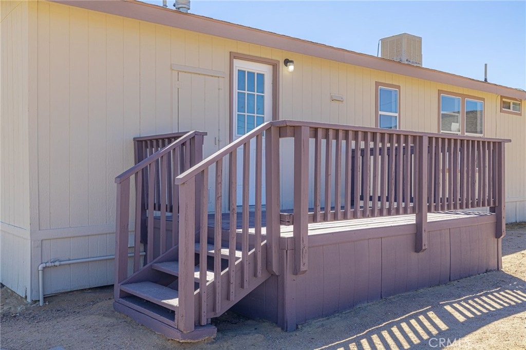 26321 Olanche Street Mojave, CA 93501 - Photo 31 of 39 a view of a house with a deck