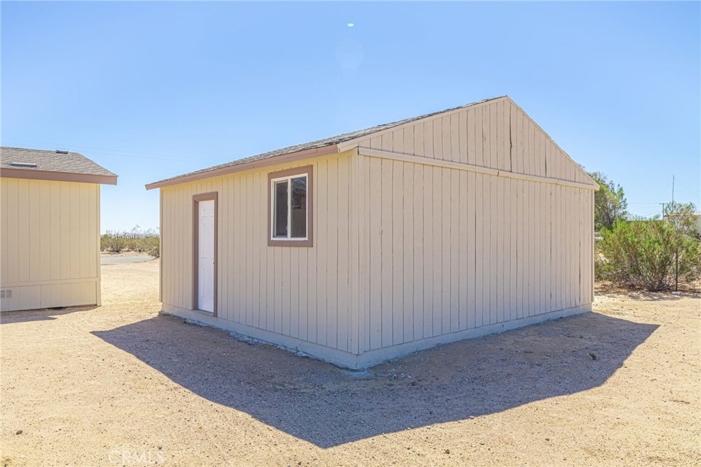 26321 Olanche Street Mojave, CA 93501 - Photo 33 of 39 a house view with a backyard