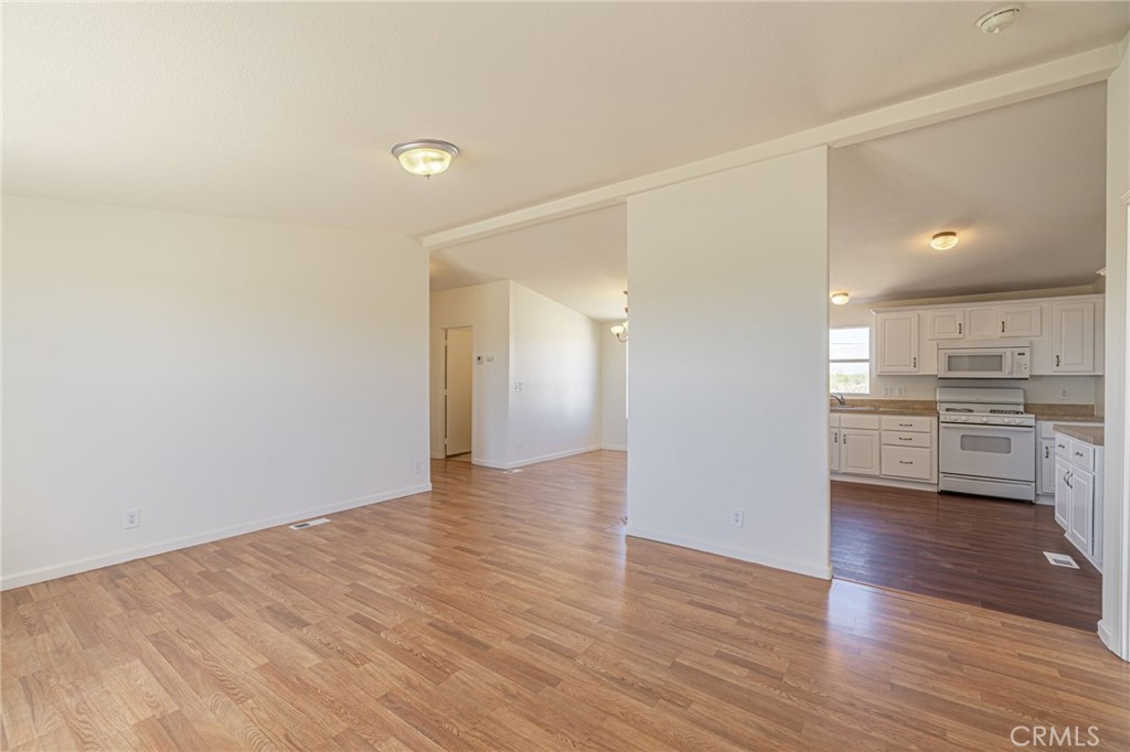 26321 Olanche Street Mojave, CA 93501 - Photo 4 of 39 a view of a kitchen with a sink and a stove top oven