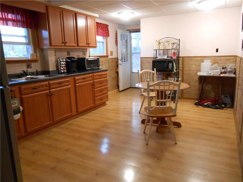 175 Elm Road Plum, PA 15239 - Photo 4 of 21 Whether you are a "quick fix style cook" or a "gourmet chef" - meal preparation made easy in the large light, bright kitchen/dining room combo. This kitchen should accommodate almost any sized table plus accessory furniture pieces with room to spare! Access to a walk-in pantry and to the backyard both off the kitchen.
